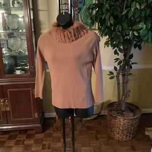 Pull on sweater with real fur collar.